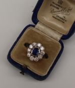 A sapphire and diamond cluster ring,