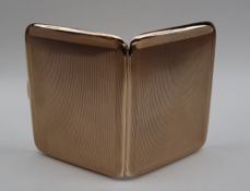 A George V 9ct gold cigarette case, of rectangular form with engine turned decoration,