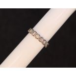 An eight stone half eternity ring,