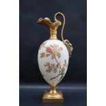 A Royal Worcester ewer with a mask handle,