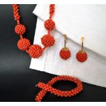 A suite of coral jewellery including a necklace, bracelet,