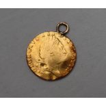 A George III gold shield back guinea dated 1791, with ring mount, approximately 8.