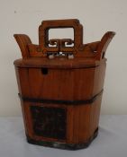 A Chinese rice bucket of octagonal tapering form, with a pierced handle,