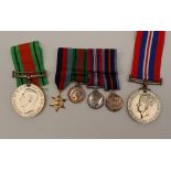 Two World War II medals including the War Medal and the Defence Medal together with a set of four