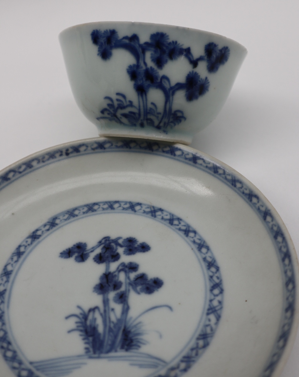 A Chinese Nanking Cargo blue and white porcelain tea bowl and saucer decorated with a tree and - Image 4 of 6