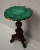 A late Victorian occasional table with a circular top decorated with malacite slivers,