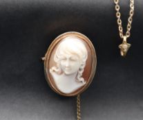 A 9ct gold shell cameo brooch depicting a head and shoulders portrait of a lady,