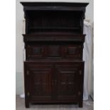 An 18th century oak Tridarn, the top section with a moulded cornice and shelf,