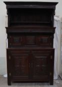 An 18th century oak Tridarn, the top section with a moulded cornice and shelf,