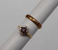 An 18ct yellow gold ruby and diamond cluster ring,