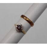 An 18ct yellow gold ruby and diamond cluster ring,