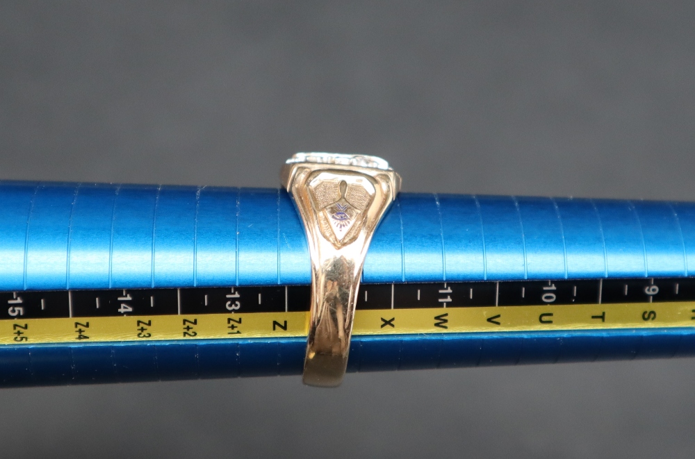 A Masonic ring, with raised white metal square, compass and radiating sun to a blue enamel ground, - Image 3 of 3