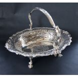 A George II silver cake basket, of pointed oval form, the border pierced with scrolls and leaves,
