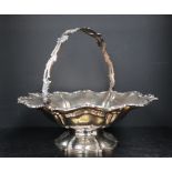 A Victorian silver swing handled cake basket, 33cm diameter, approximately 950 grams,