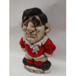 A John Hughes pottery Grogg of a Rugby player in Welsh kit with no 10 to the reverse,