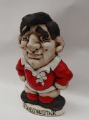 A John Hughes pottery Grogg of a Rugby player in Welsh kit with no 10 to the reverse,