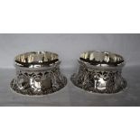 A pair of Edward VII shallow bowls of Irish dish ring type, with a pierced flared skirt base,