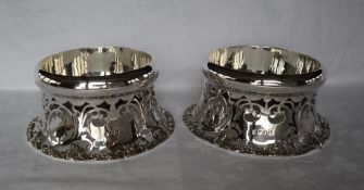 A pair of Edward VII shallow bowls of Irish dish ring type, with a pierced flared skirt base,