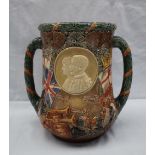 A Royal Doulton twin handled loving cup to celebrate the completion of 25 years reign of their