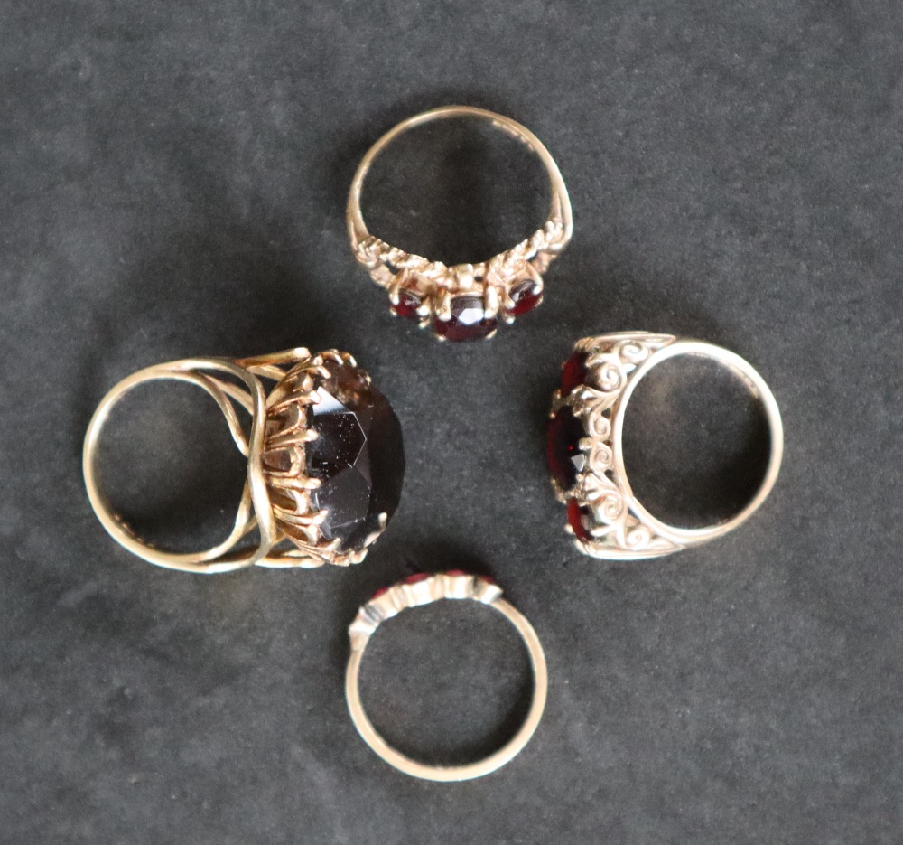 A 9ct gold ring set with three oval faceted garnets, - Image 2 of 3