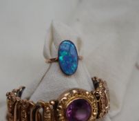 A 9ct gold opal ring, set with an oval opal panel, size N, approximately 2.