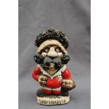 A John Hughes pottery Grogg of a rugby player in Welsh kit, the number 8 to the reverse,
