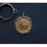 A Victorian young head sovereign dated 1880, in a yellow metal mount and another yellow metal mount,