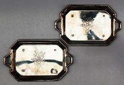 A pair of Elizabeth II silver twin handled pin trays of rectangular form with cut corners,