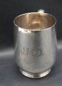 A George V silver tankard, of tapering cylindrical form on a spreading foot, Sheffield, 1924,