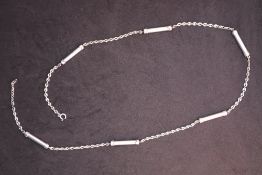 A continental white metal 800 standard necklace with oval links and cylindrical barrels, 86.