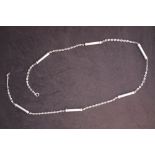 A continental white metal 800 standard necklace with oval links and cylindrical barrels, 86.