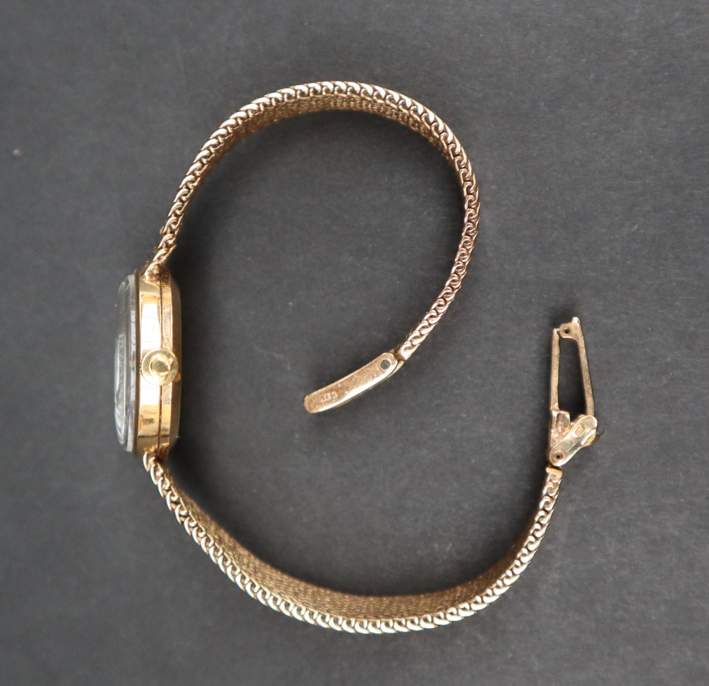 A lady's 9ct gold Omega wristwatch, the gilt dial with batons on an integral 9ct gold strap, - Image 4 of 6