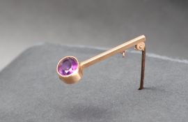 A 9ct yellow gold amethyst set bar brooch, approximately 2.