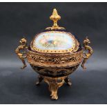 A French gilt metal mounted Sevres style pot pourri pot and cover with grotesque handles,