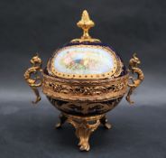 A French gilt metal mounted Sevres style pot pourri pot and cover with grotesque handles,