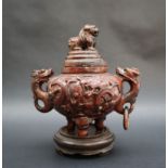 A Chinese hardstone urn and cover with a dog of foo finial,