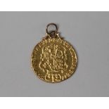 A George III gold shield back Guinea dated 1766, with a fixed pendant mount, approximately 8.