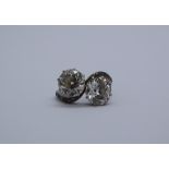 A two stone diamond ring, each old round cut diamond approximately 2.