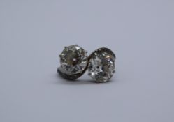 A two stone diamond ring, each old round cut diamond approximately 2.
