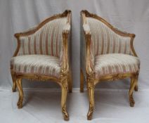 A pair of French gilt decorated corner chairs, carved and gilt decorated with flowers and leaves,