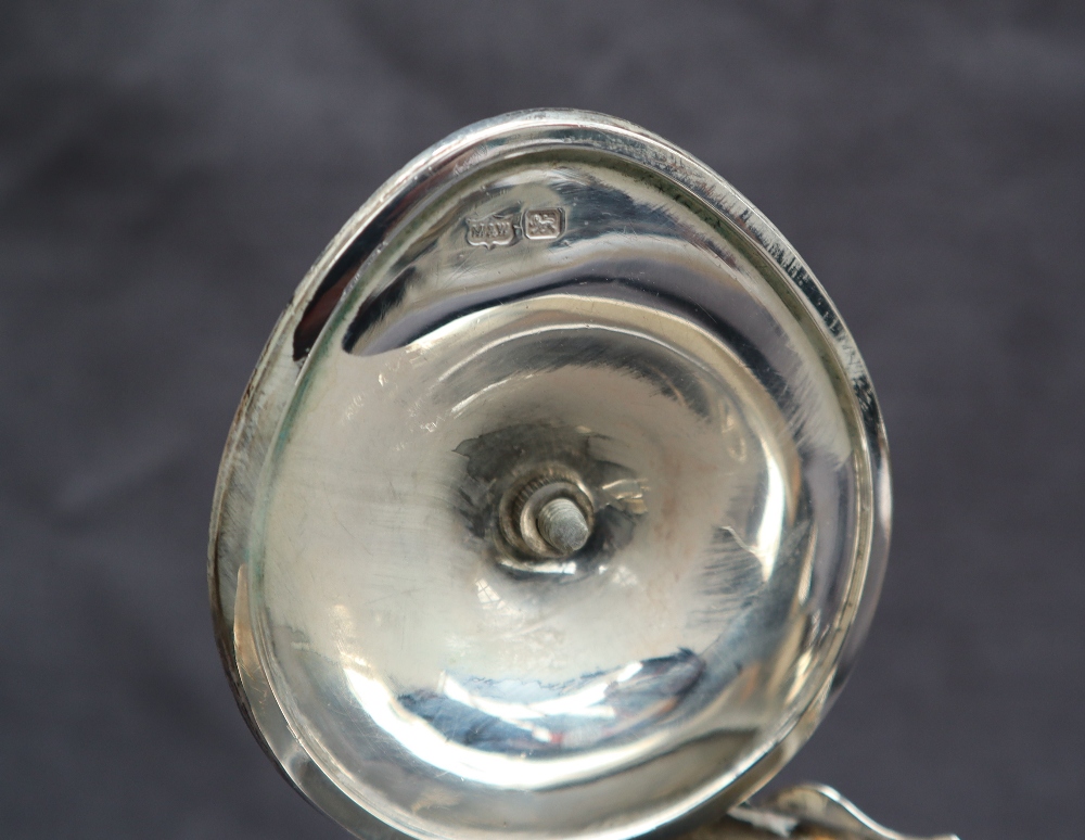 An Edward VII silver hot water jug with a flared edge and baluster body on three legs with trefid - Image 3 of 5