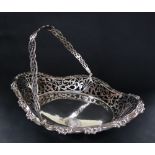 An Edward VII swing handled cake basket, of oval form with pierced decoration,