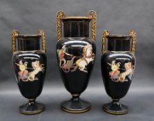 A garniture of three Grecian twin handled vases decorated with fighting gladiators to a black
