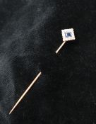 A sapphire and diamond stick pin, the princess cut sapphire surrounded by round old cut diamonds,