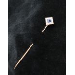 A sapphire and diamond stick pin, the princess cut sapphire surrounded by round old cut diamonds,