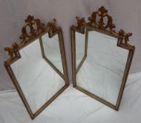 A pair of French gilt gesso wall mirrors,