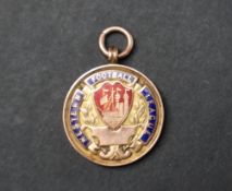 A 9ct yellow gold and enamel decorated football medallion of circular form,