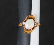 A 14ct yellow gold opal and diamond ring,