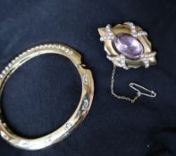 A rock crystal and seed pearl brooch, of pointed oval form,