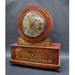 A Victorian rosewood and brass inlaid bracket clock, with a circular brass dial,